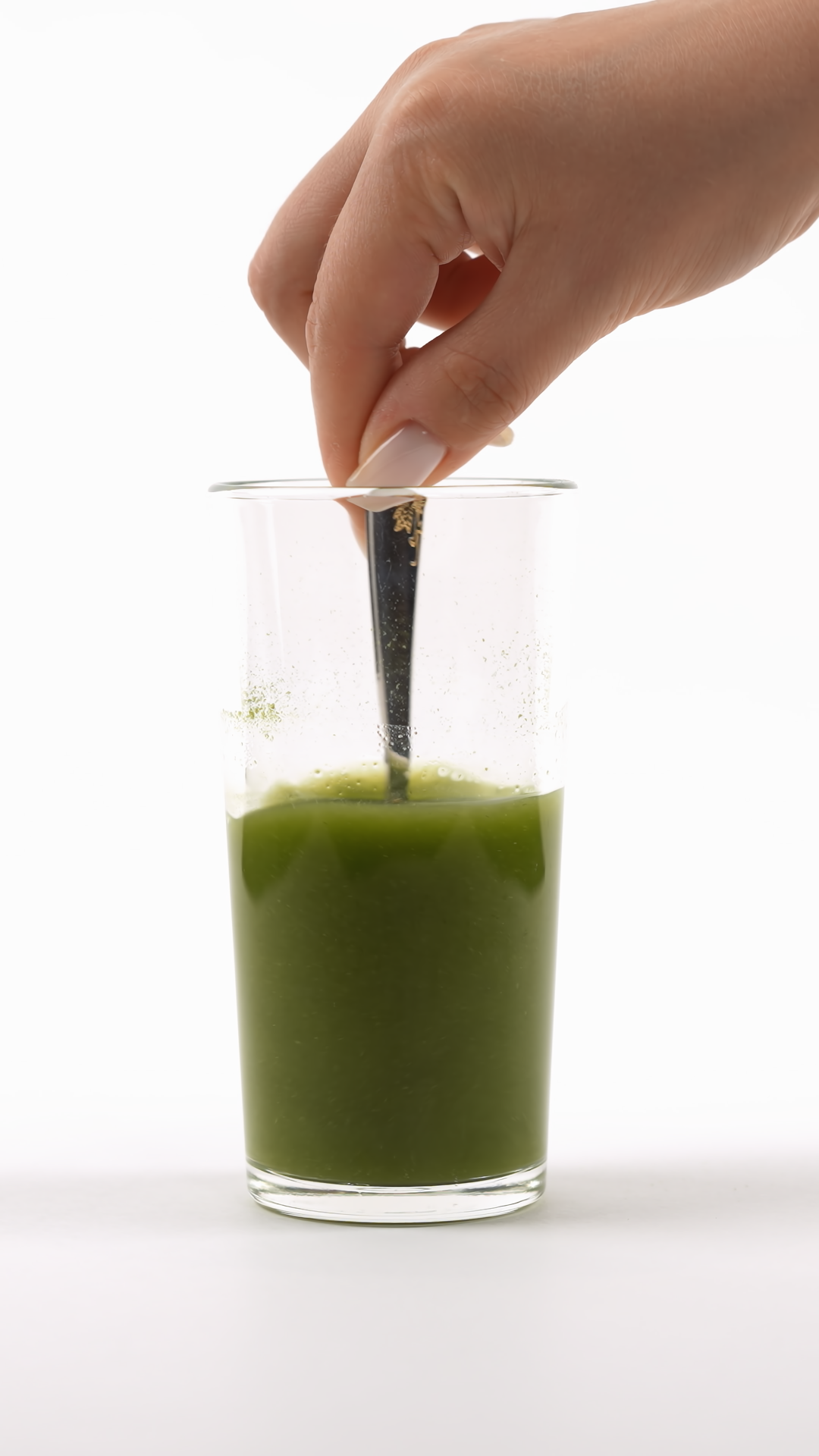 Hand Stirring Green Smoothie With Fork In Stock Footage SBV-353064319 ...