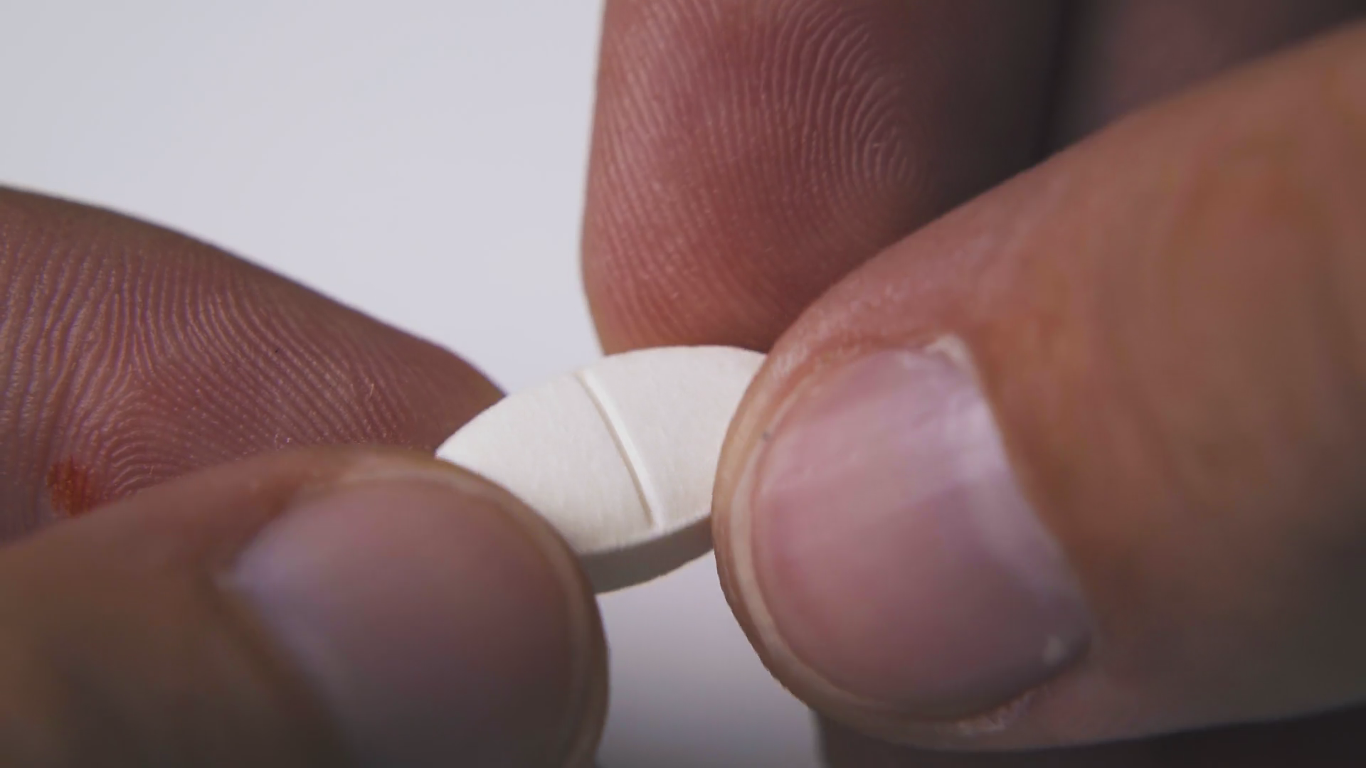 Ill Person Breaks White Oval Medical Pill To Stock Footage SBV