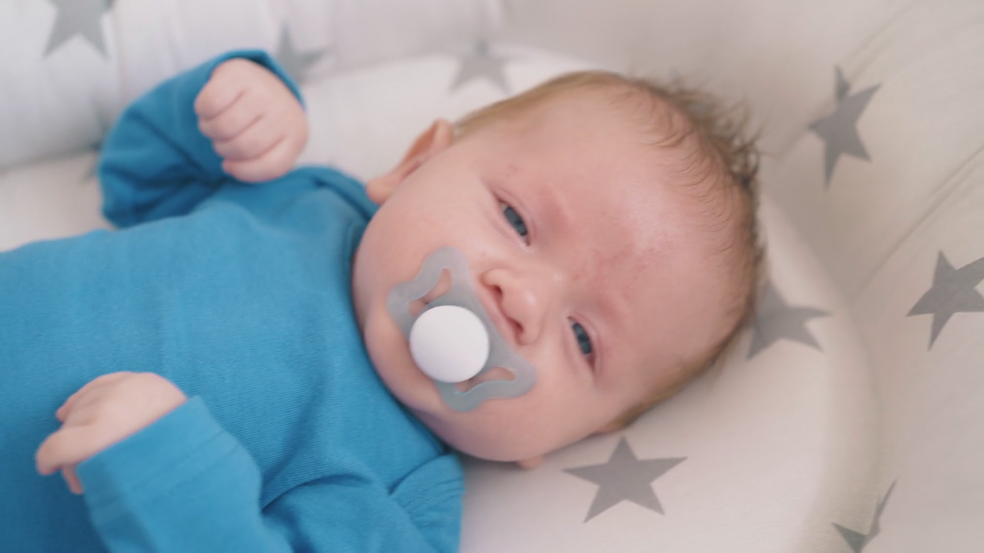 Blue Eyed Baby Boy With Dummy Falling Asleep Stock Footage SBV