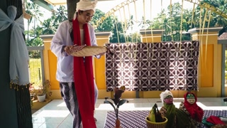 Traditional Indonesian Cultural Scene with Dolls
