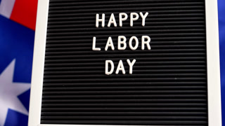 Australian flag and message board text HAPPY LABOR DAY festive holiday greetings. Concept of workers rights and public holiday, use in labor