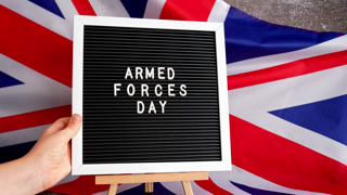ARMED FORCES DAY patriotic scene with signboard and waving flag message UNITED KINGDOM with national colors Festive background with British