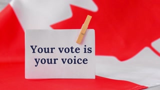 4k zoom in out The National Flag of Canada. Canadian flag with Maple leaf paper note message text. Election day, give vote, your vote