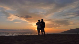 Couple Kissing On Beach At Sunset
