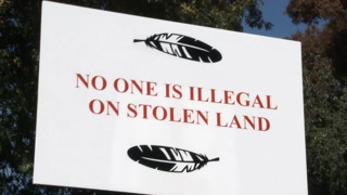 No One Is Illegal On Stolen Land Protest Sign