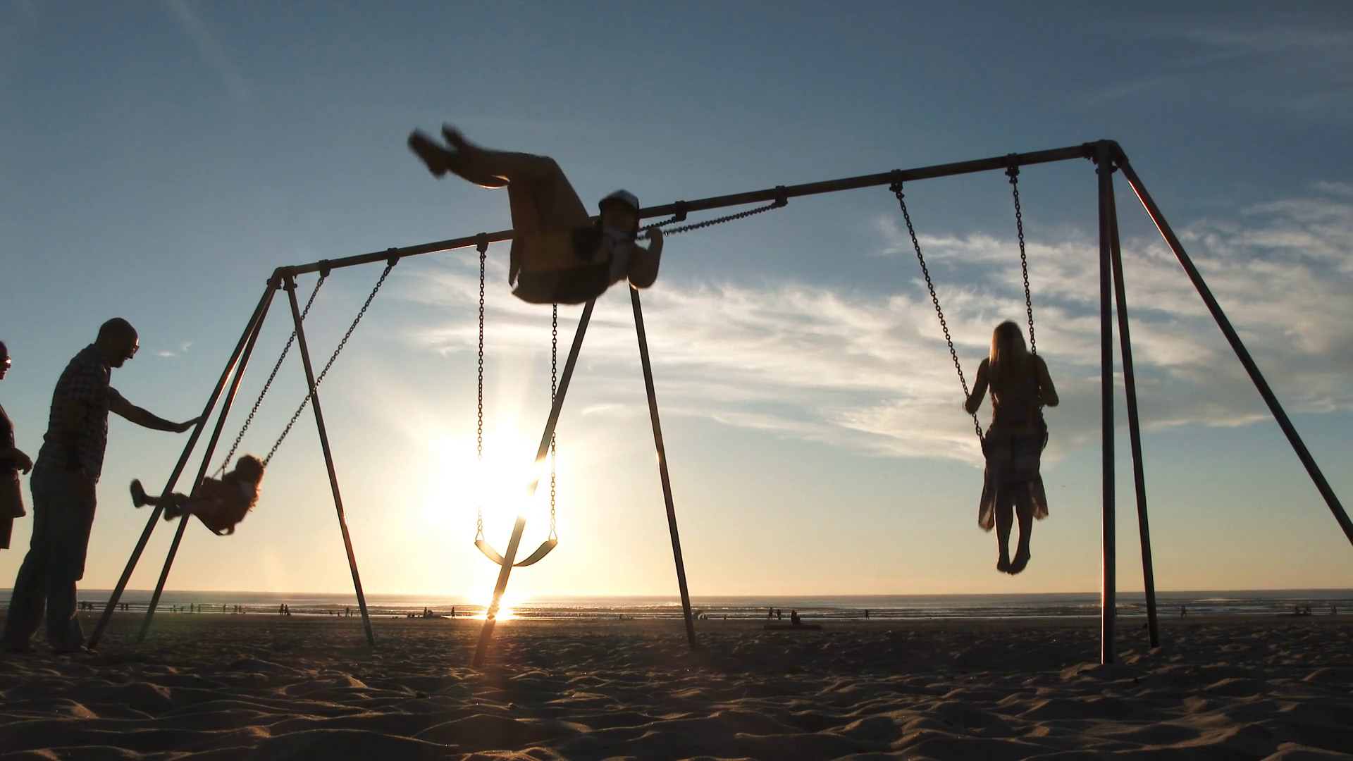 People On Beach Swing Set At Sunset Slow Motion Stock Video Footage