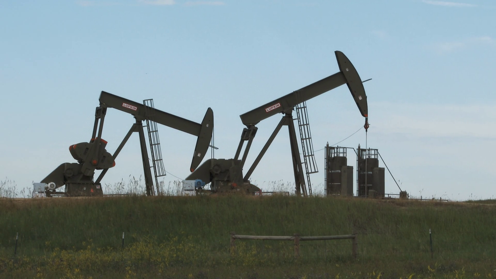Two Oil Rigs Pumping Well In Field Stock Video Footage - Storyblocks