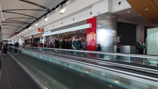 Ed: Det, Mi, Usa 07/24: Hyperlapse of People on People Mover in Airport by Mcdonalds Store