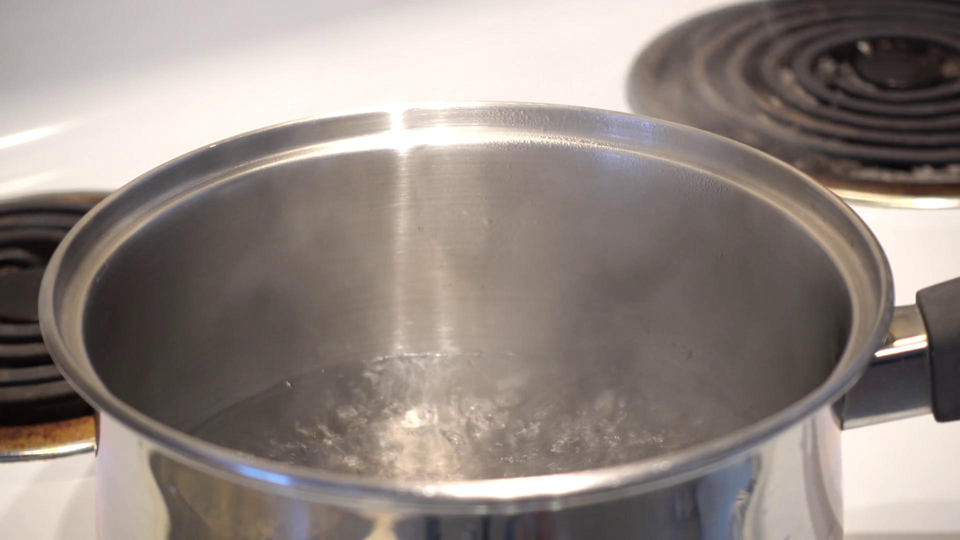 A Pot Of Water Boils Vigorously Releasing Stock Footage SBV347744481