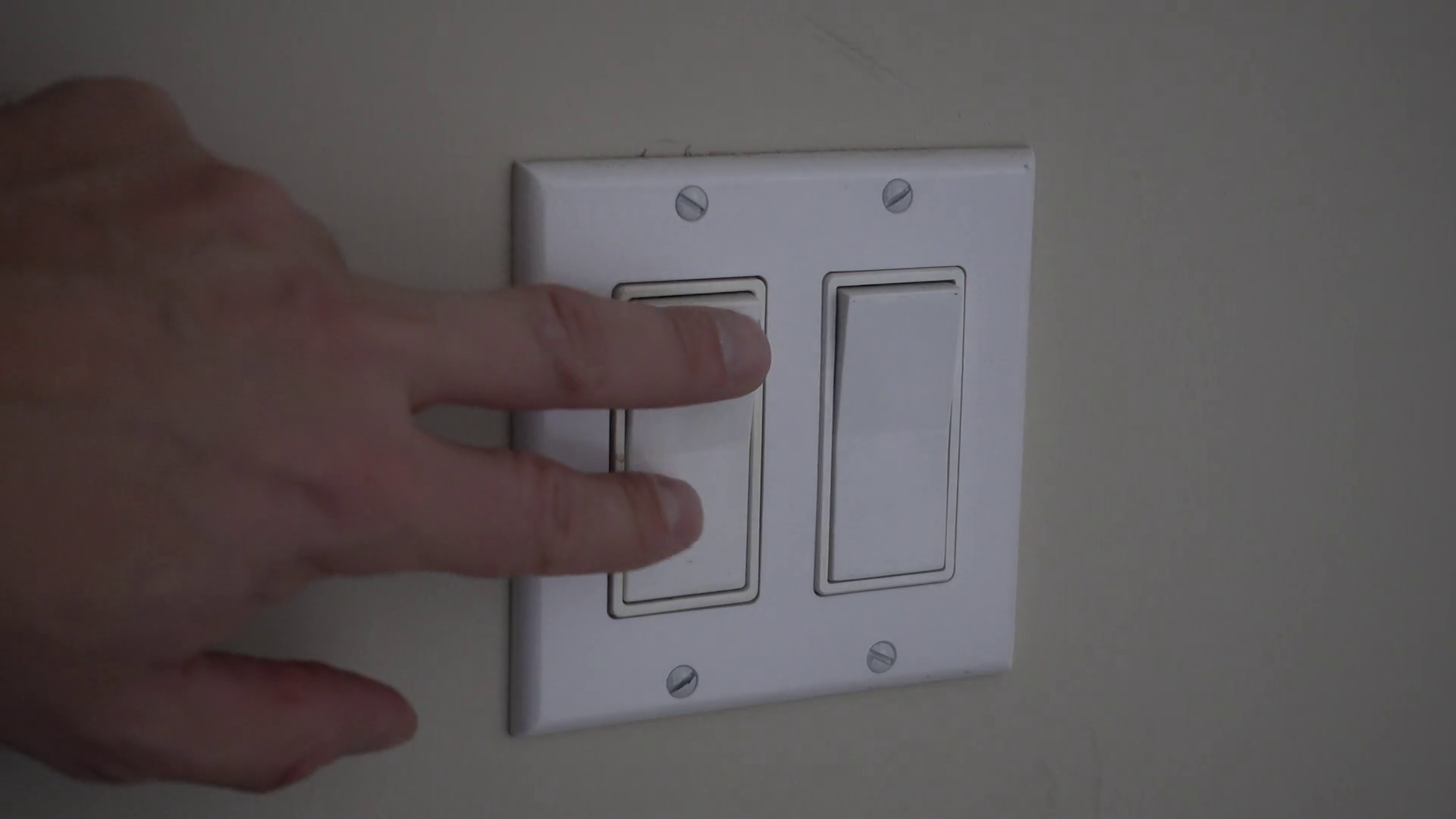 A Man's Hand Is Seen Turning On Light Switch Stock Footage SBV