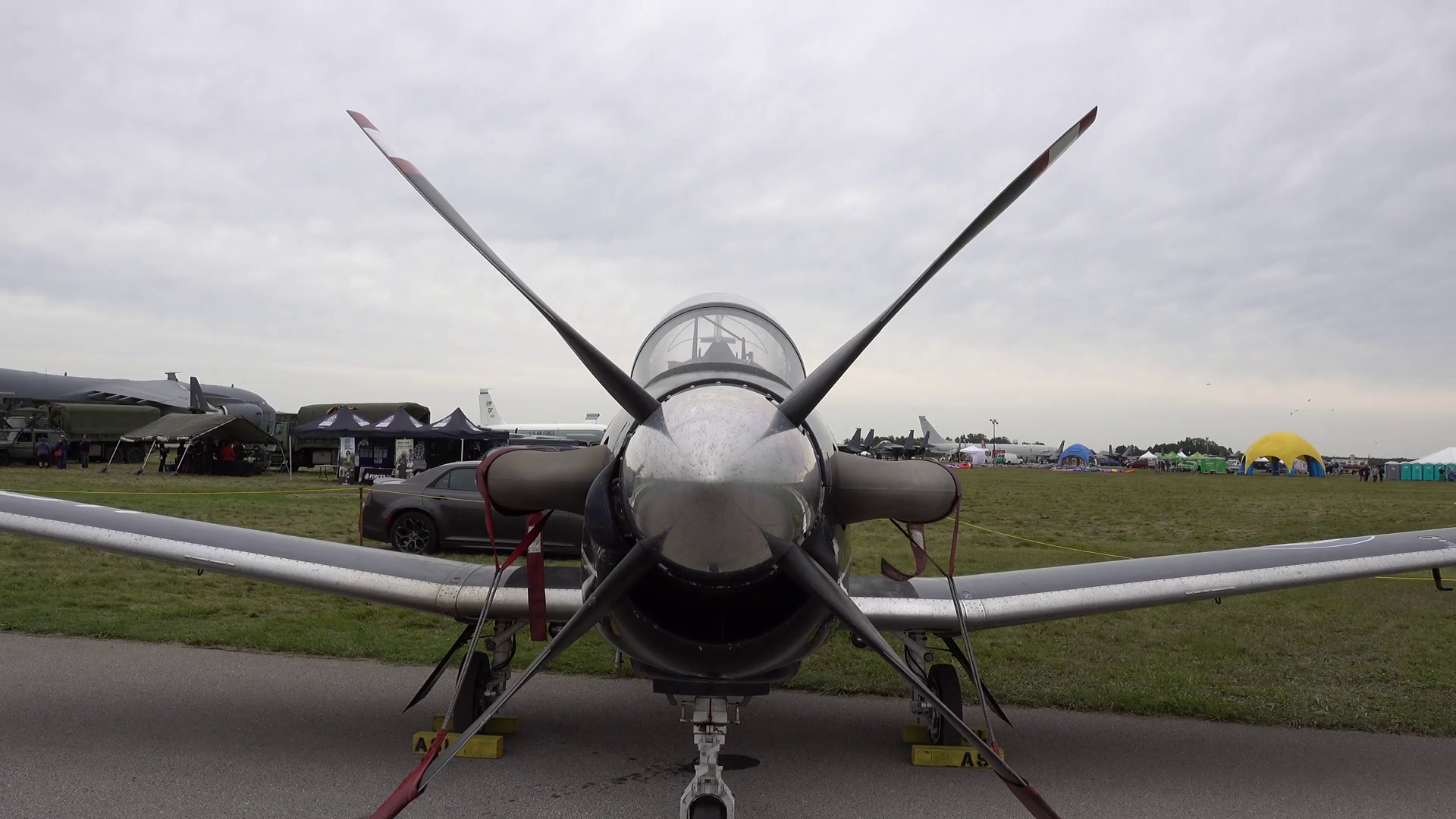 On Windy Day Military Plane Is Strapped Down Stock Footage SBV