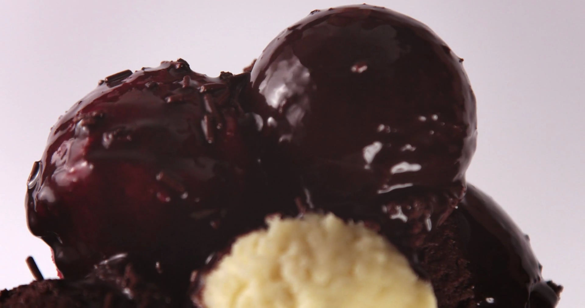 Closeup Of Ice Cream Balls Covered Chocolate Stock Footage SBV