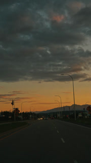 Sunset Over a Winding Mountain Road