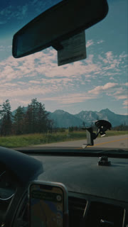 Driving Through the Mountains Over the Dashboard