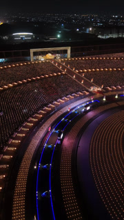 Aerial Night View of Buddhists Holding Candles at Wat Phra Dhammakaya