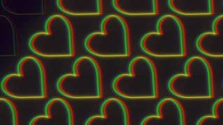 A vibrant and harmonious circular pattern composed of overlapping hearts in varying shades of red, green, and blue creates a visually pleasing and symmetrical design