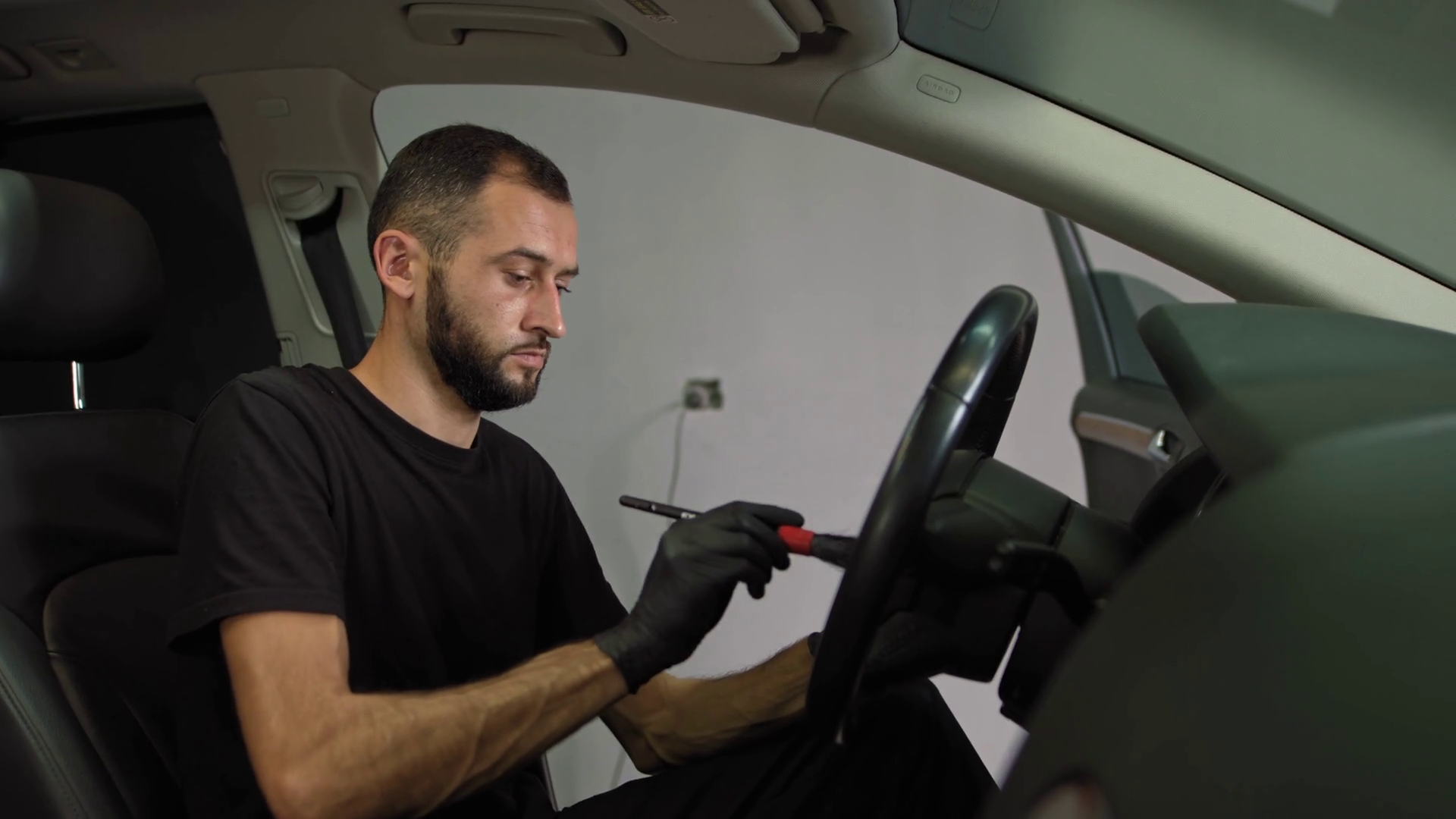 Professional Car Interior Cleaning Man Wipes Stock Footage SBV