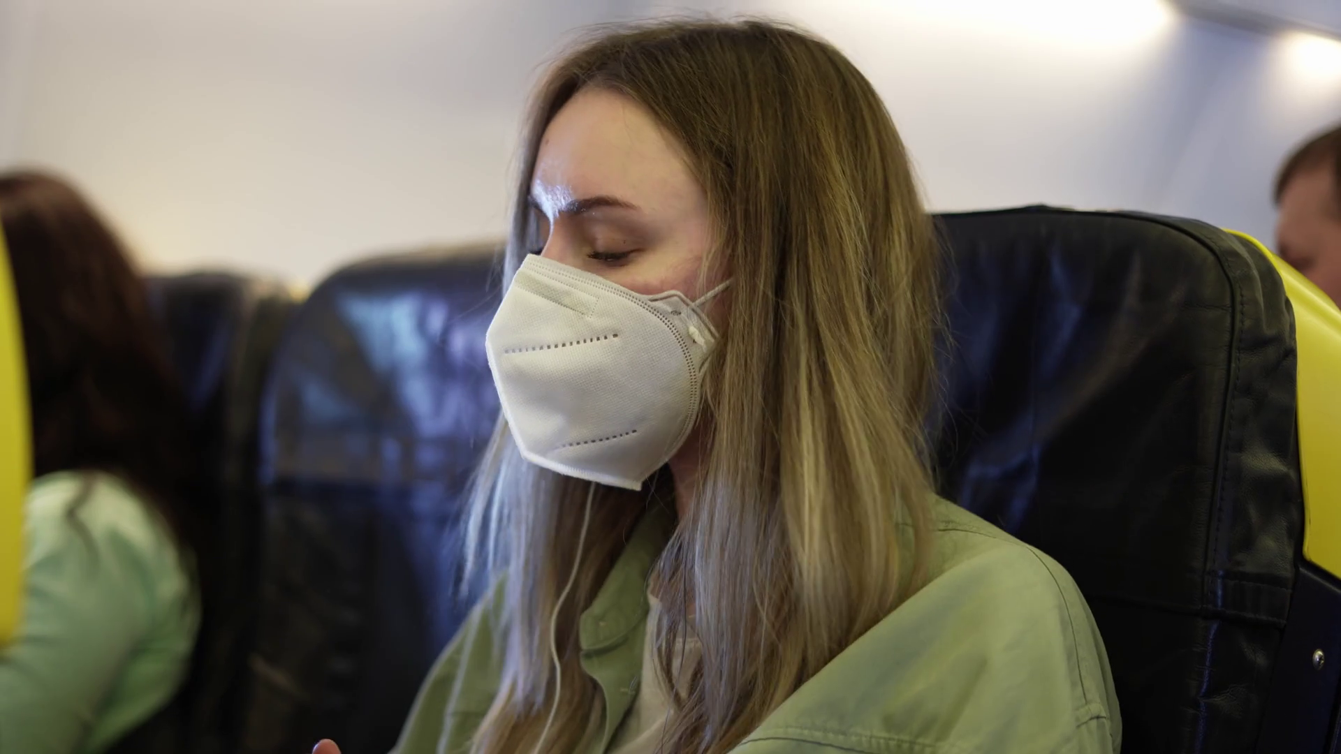 Traveller In Airplane Putting On Earphones Stock Footage SBV346800681