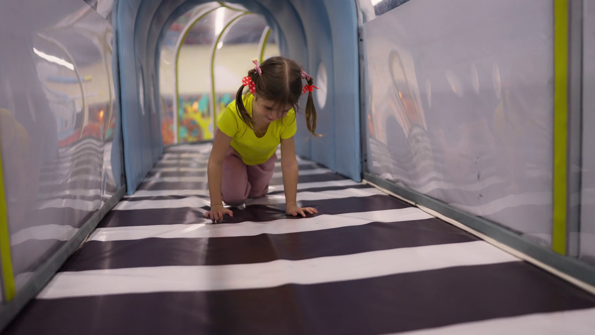 Happy Little Girl Crawling Through Tunnel On Stock Footage SBV