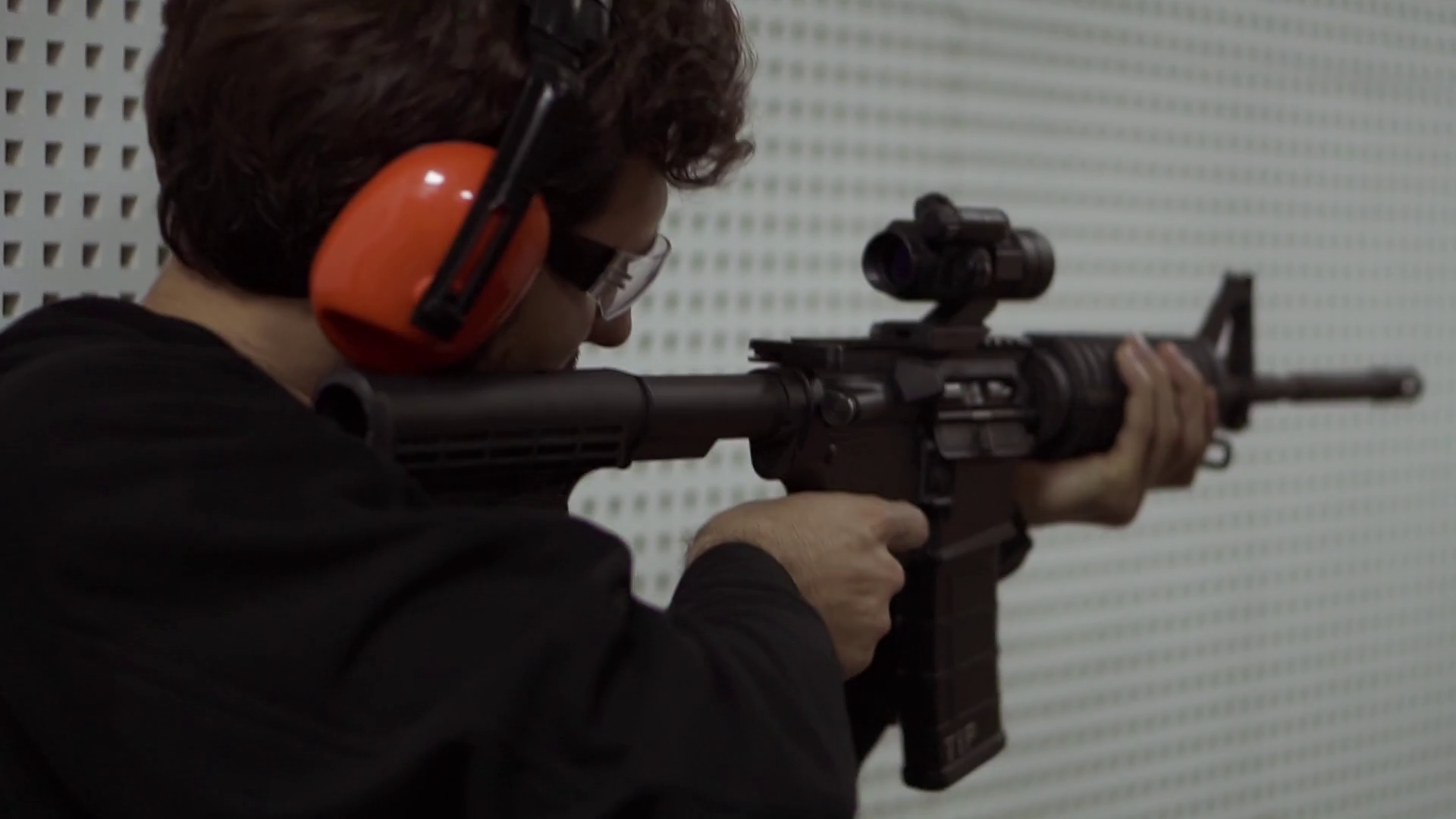 Man Shooting at Firing Range in headphones Stock Video Footage 0005