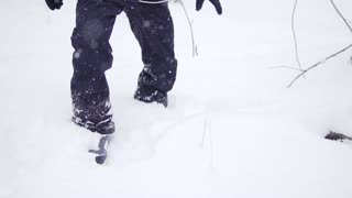 Man walking in snowboard shoes on the snow
