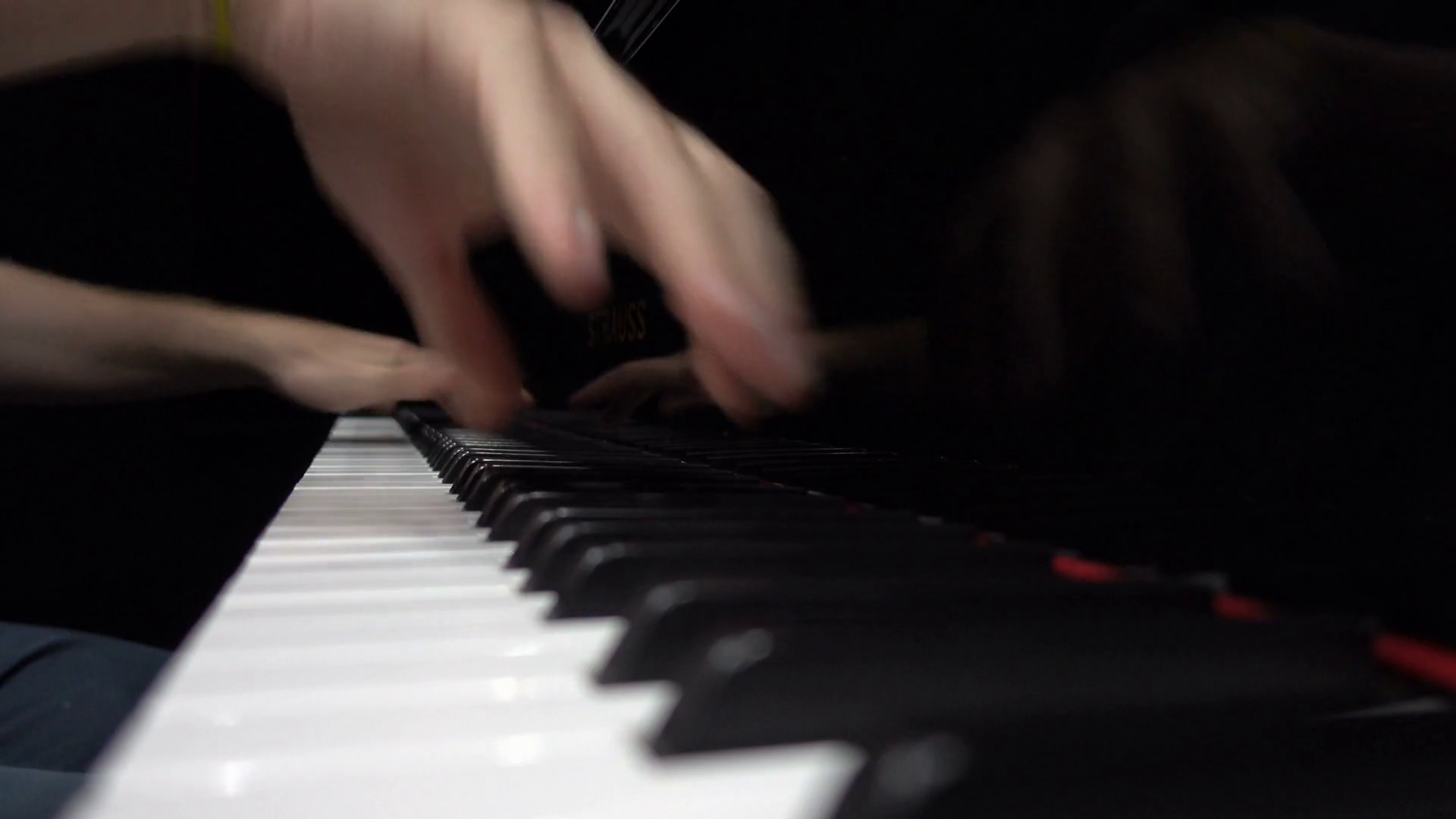 Hands playing the piano closeup low shot. Pianist plays music