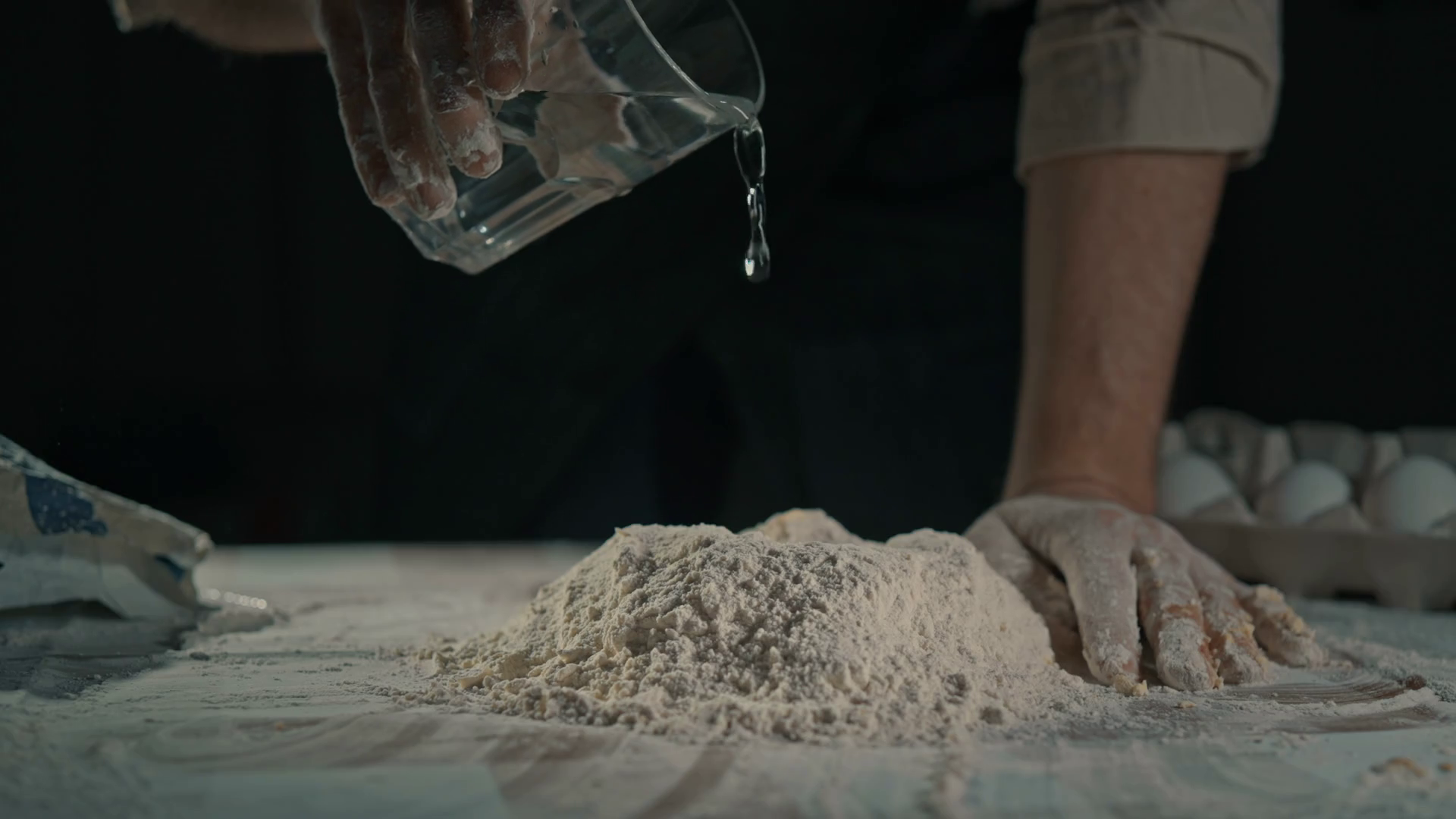Man Pouring Water On Flour Making Dough Stock Footage SBV347527786