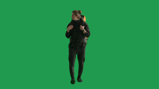 A Walking Male Tourist with a Hiking Backpack on His Back Stops and Waves His Hand in Greeting When. A walking male tourist with a hiking backpack on his back, stops and waves his hand in greeting when he sees his acquaintances. A man hiker in the st