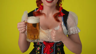 Close Up Yellow Background Isolated Video of an Unrecognizable Young German Woman Waitress Wearing a. Close up yellow background isolated video of an unrecognizable young German woman, waitress wearing a traditional costume, holding a platter with pr
