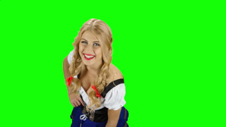 Girl in Bavarian Costume Drinking Beer From the Glass and Licked. Green Screen