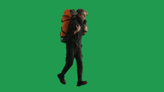 Hurried Male Traveler Running with Backpack on His Back Tourist in Studio on Green Screen Last. Hurried male traveler running with backpack on his back. Tourist in studio on green screen. Last moment for rush hiking and vacation