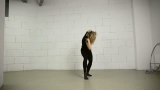 Asian woman dances in studio modern and street choreography Jazz-funk