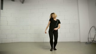 Asian woman dances in studio modern and street choreography Jazz-funk