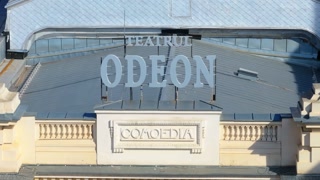 Bucharest, Romania - March 03, 2024: Aerial drone view of the sign above the entrance to the Odeon theater in the sunlight