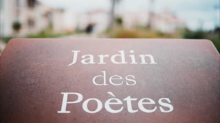 Jardin des Poetes sign at the entrance of the garden in Antibes, France