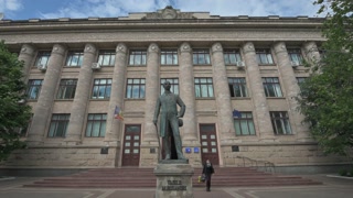 Vasile Alecsandri's bronze statue in front of National Library of Moldova in Chisinau