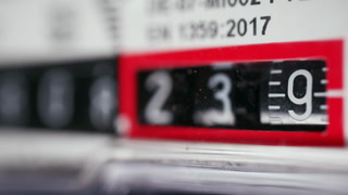 Close up of a mechanical counter displaying rotating numbers