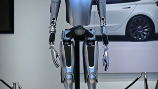 Milan, Italy - March 21, 2025: Close up of a Tesla Bot, robotic humanoid, displayed at the showroom