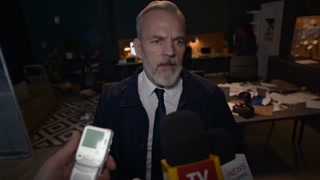 Medium shot of mature Caucasian male detective in black suit sharing investigation process details with various TV correspondents interviewing him, commenting on crime case in office