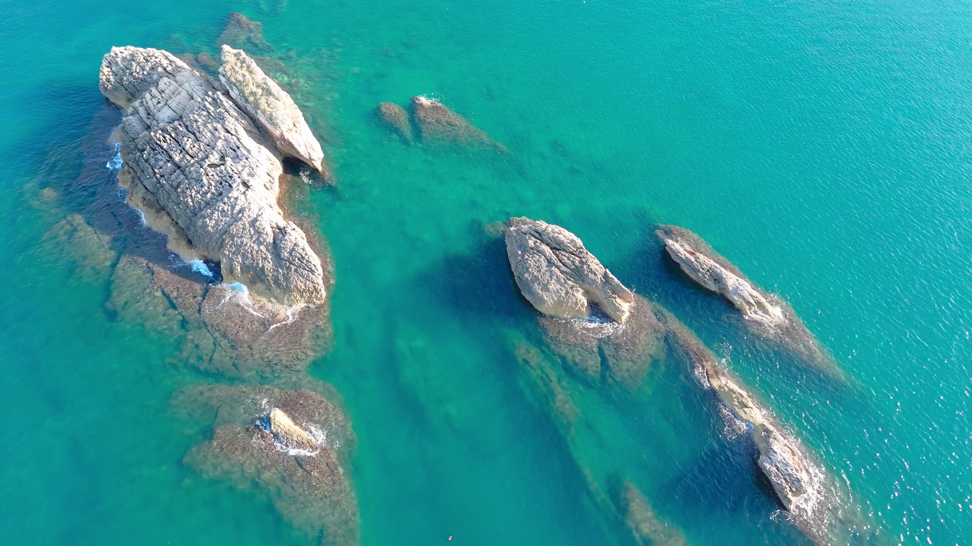 Aerial View: Stunning Rocks Emerging From Sea Stock Footage SBV ...