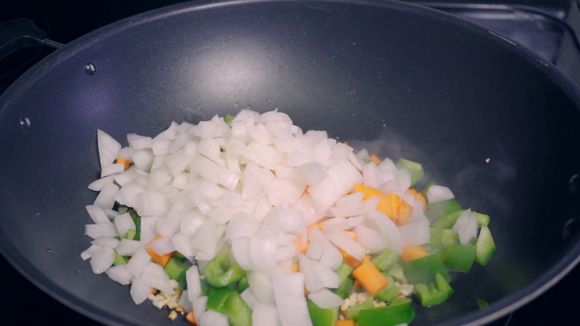Making Stir Fry Vegetables Using Wok In Home Stock Footage SBV