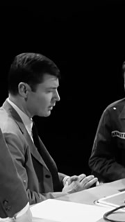 A Chief Warrant Officer and an Examiner meet with a soldier, explaining his rights and getting his signature before talking a polygraph test, in an office, in 1966.