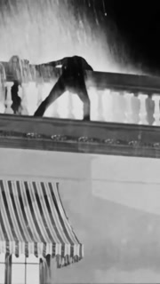 US - 1925 - in this silent drama, a man saves a woman from a gorilla on the roof of a building, but now the gorilla goes after him as he climbs down the building. He barely escapes.