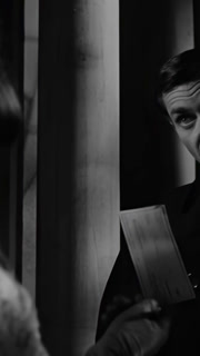 US - 1964 - in this horror film, a woman hands a psychic a check but he doesn't want to charge unless they're dealing with a real ghost. She then hands him the key to her house.