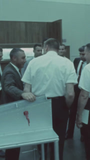 USA - 1963 - Gus Grissom checks in at the McDonnell Douglas plant.