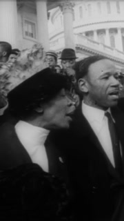 1967 - African-American demonstrators gather on Capitol Hill in support of Congressman Adam Clayton Powell, who was just ousted as chairman of the Education and Labor Committee.