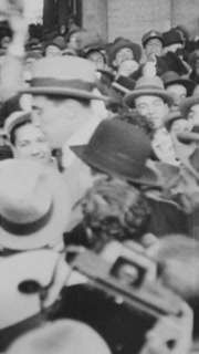 1933 - Heavyweight champion Primo Carnera is mobbed by fans and knocks back some drinks (narrated in 1958).