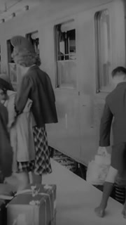1940 - Expat American families arrive at a train station in France.
