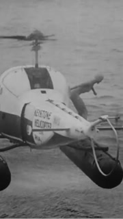 1958 - A large reception awaits Esther Williams in Atlantic City, New Jersey for the premiere of her new movie "A Raw Wind in Eden." As a publicity stunt, she dives out of a helicopter into water near a beach.