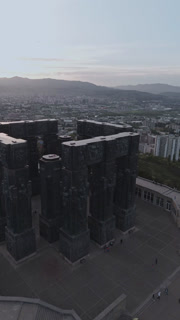 Aerial view of the Chronicle of Georgia's imposing monument, its dark stone contrasting against the skyline, Tbilisi, Georgia.